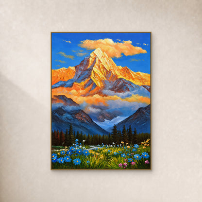 Golden mountain above blue mist, evergreen forest and a wildflower meadow, in a slim gold floating frame on an ivory wall