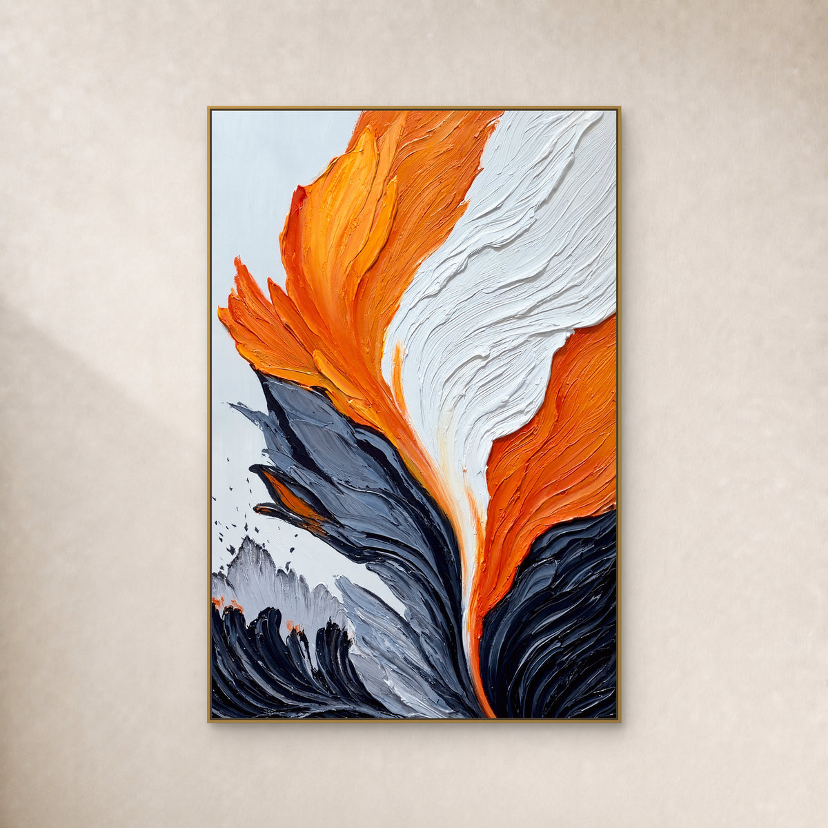 Orange, white and charcoal abstract painting with raised ridges, in a thin gold-tone floating frame on an ivory wall