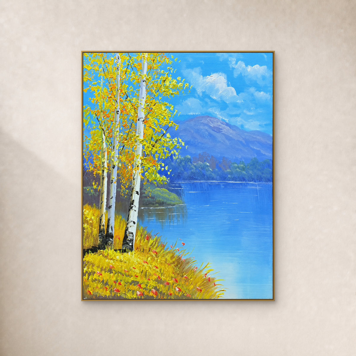 Golden birches beside a blue lake and violet mountains, in a slim gold frame on a warm ivory wall.