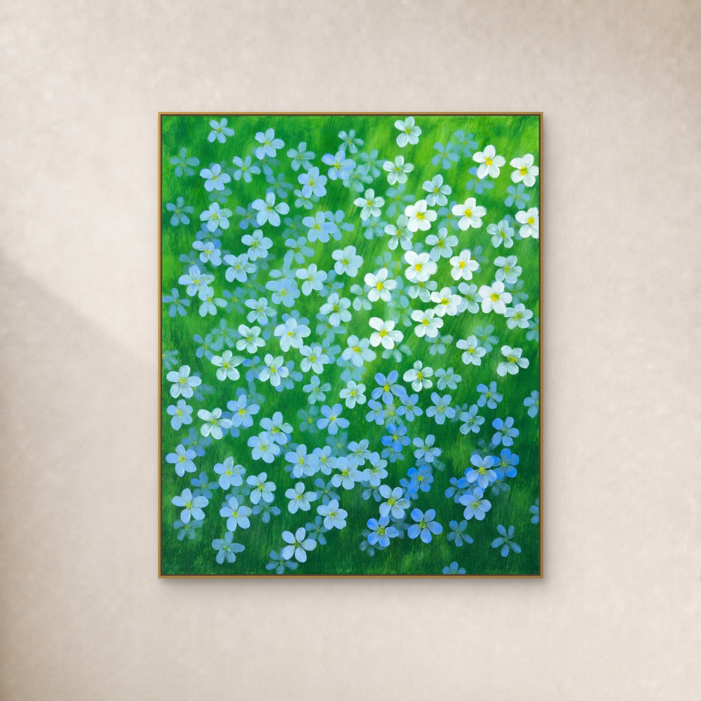 Blue flax flowers painted across a green field, displayed in a floating frame