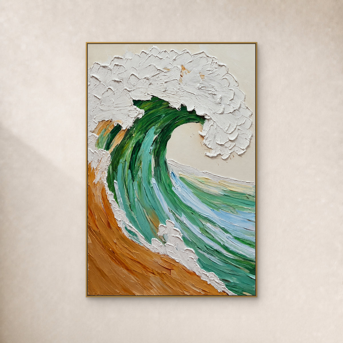 Emerald-green wave with raised white foam and an ochre base in a slim gold-tone frame on an ivory wall
