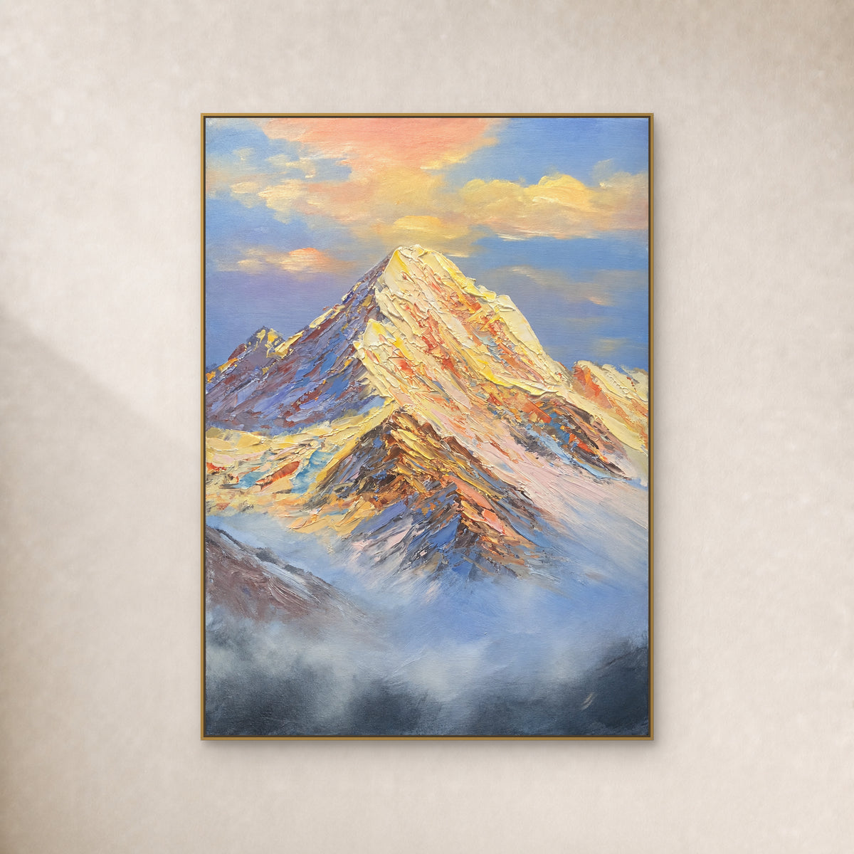 Golden snow peak above blue-grey mist in a thin gold floating frame on an ivory wall