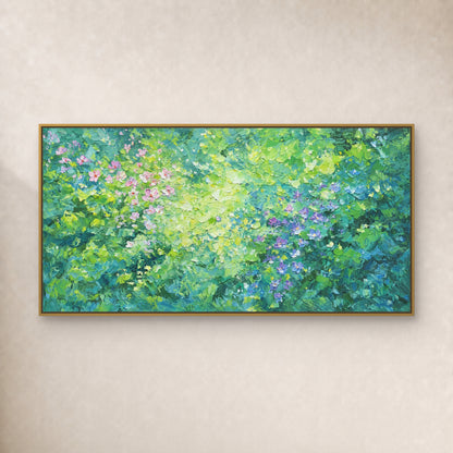 Wide green floral painting with pink and violet blossoms in a thin gold-toned floating frame on a plain ivory wall