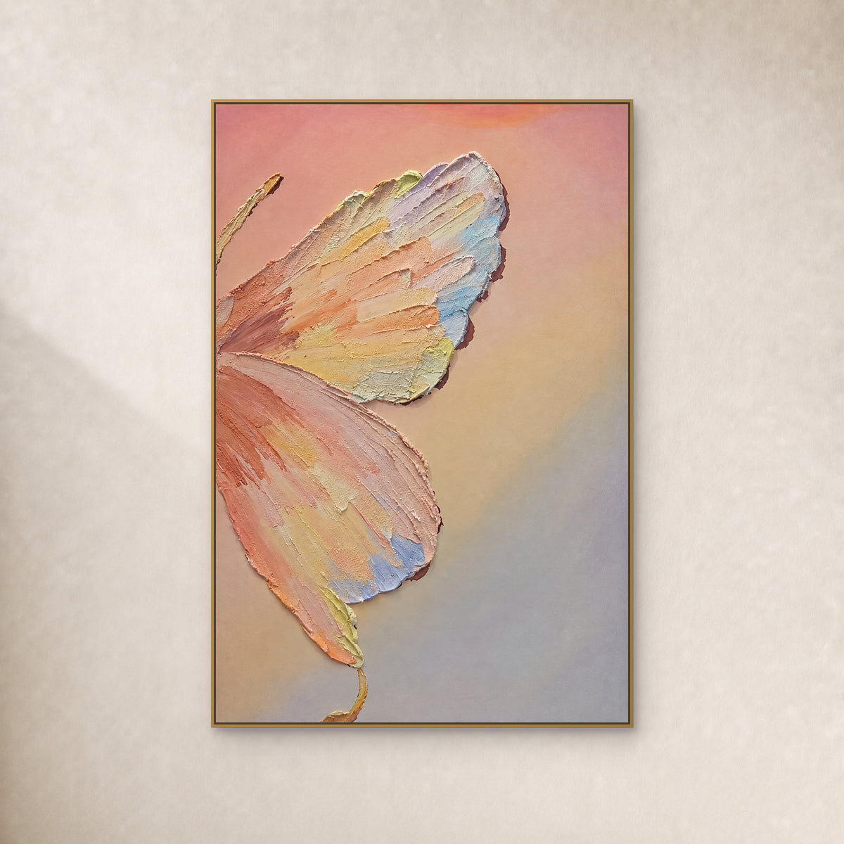 Pastel butterfly with raised wing strokes in a thin gold floating frame on an ivory wall