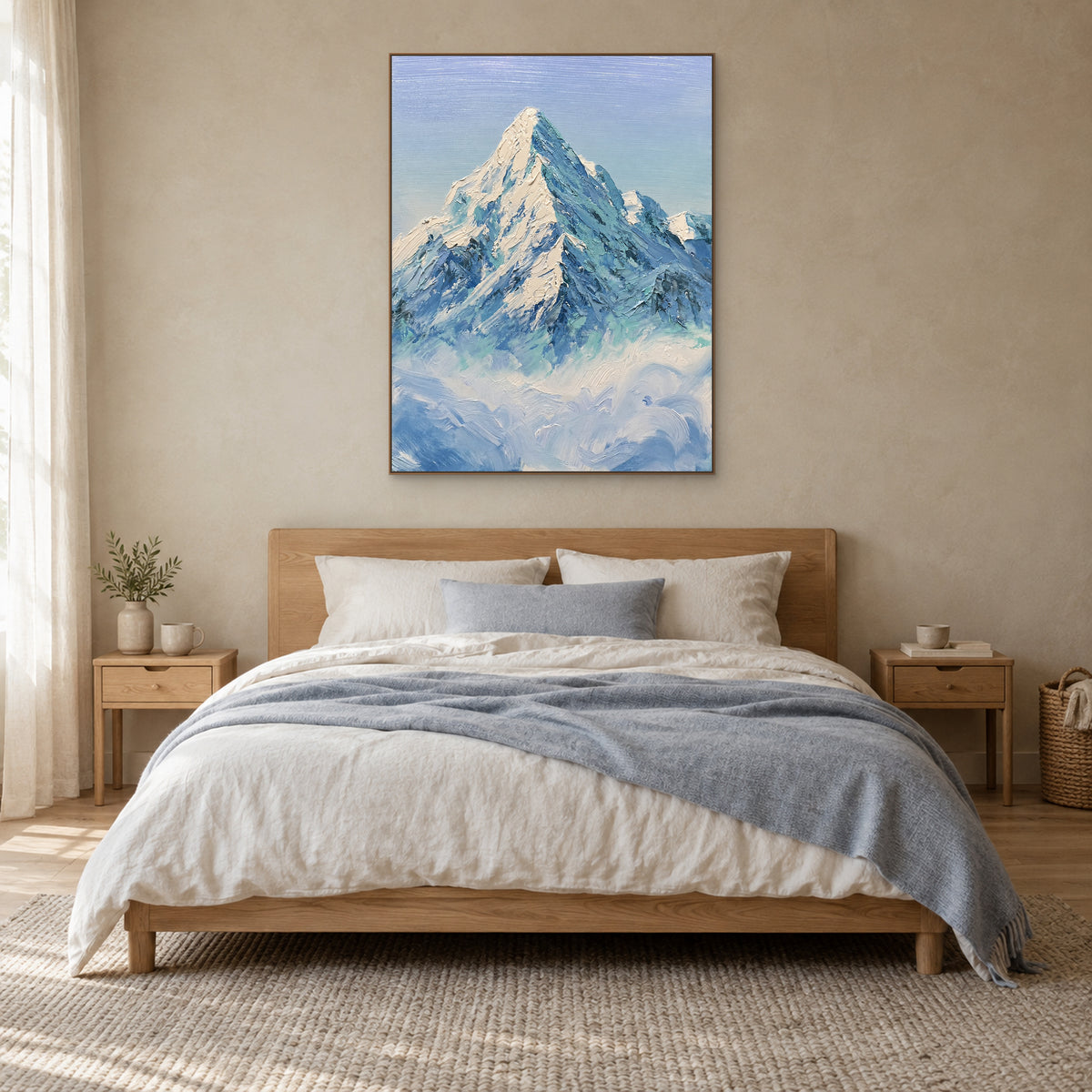 Blue-green snow mountain painting in an oak-look frame, centred above a bed with a light wood headboard.