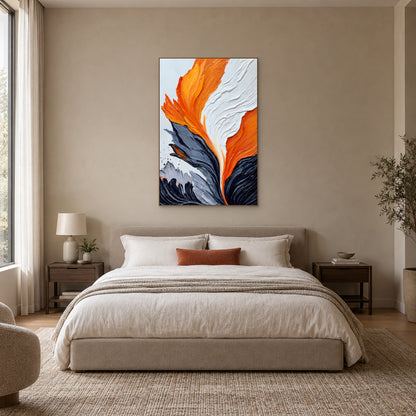 Vertical orange and white abstract painting in an oak-tone frame centred above an upholstered bed