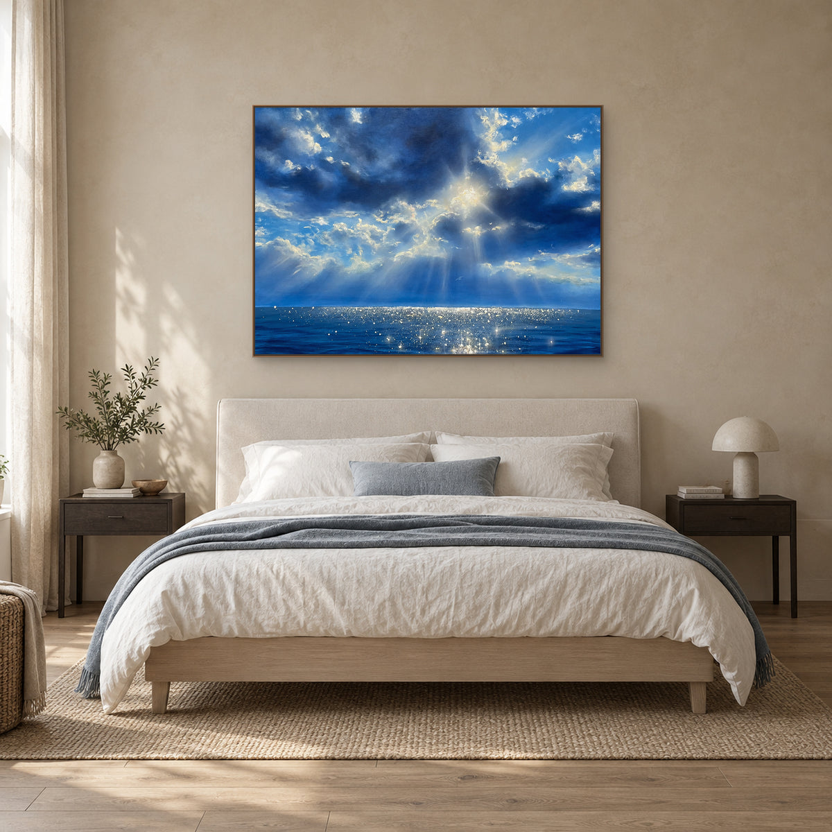 Blue Reverie in a slim oak-look frame centred above a cream upholstered headboard.