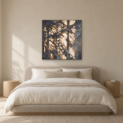 Dappled Gold abstract painting in an oak-look floating frame centred above a bedroom headboard