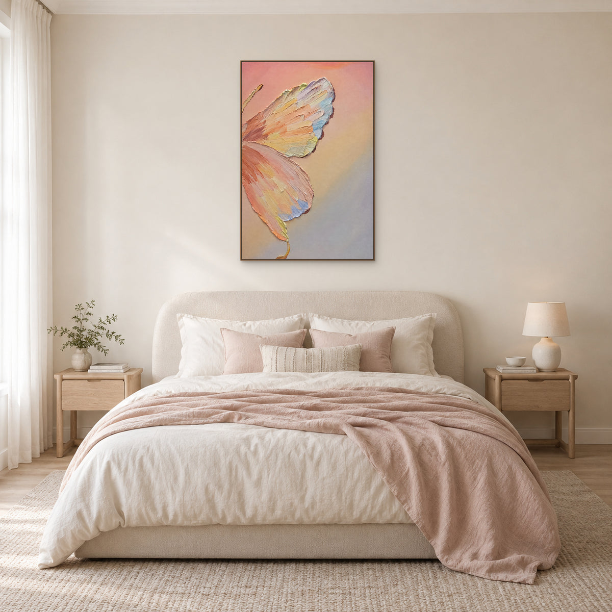 Pastel butterfly artwork in an oak-tone floating frame centred above a cream upholstered bed