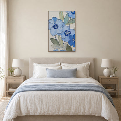 Vertical blue floral relief in an oak-tone frame centred above a cream upholstered bed