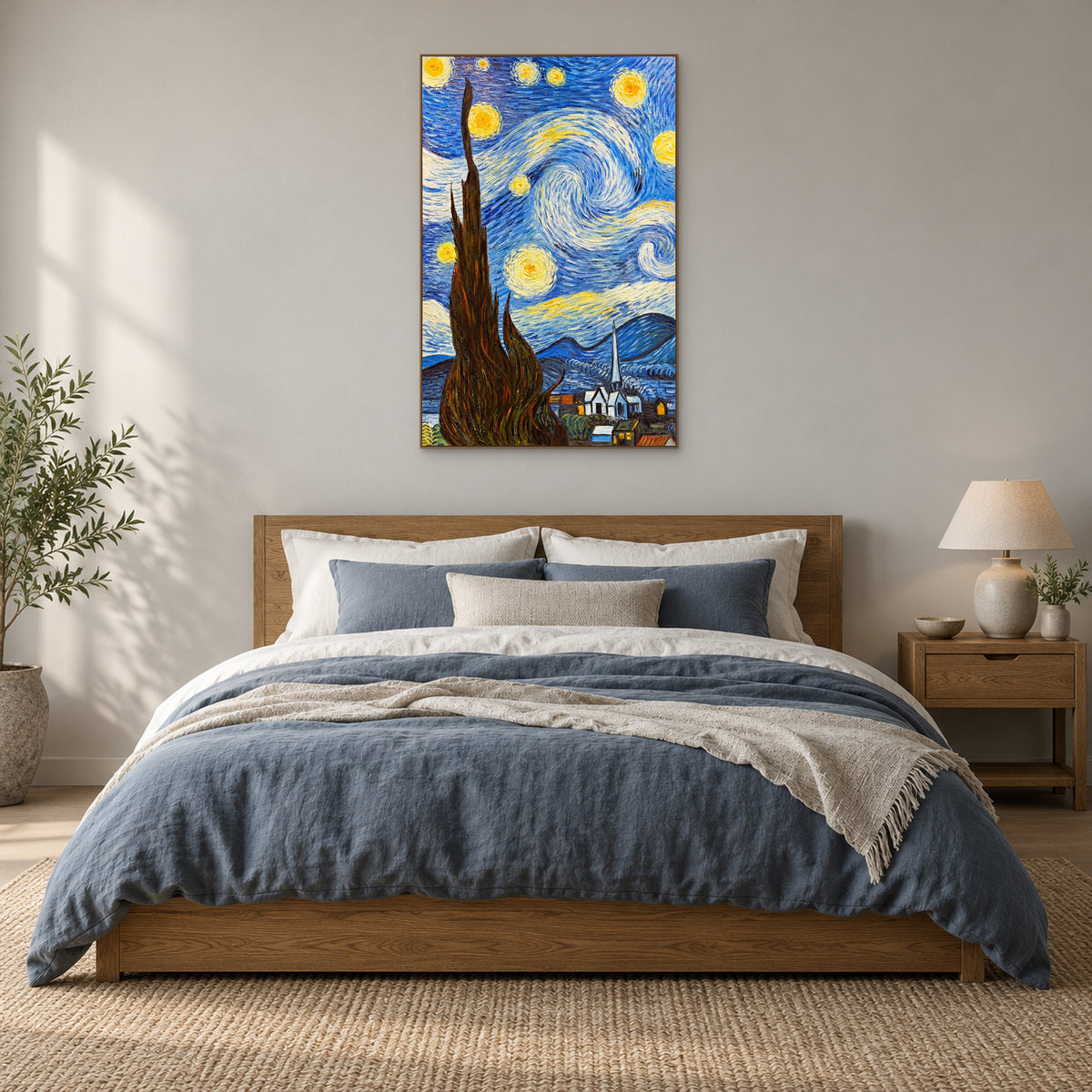 Vertical starry cypress painting in an oak-tone frame above a wooden headboard and slate-blue bedding