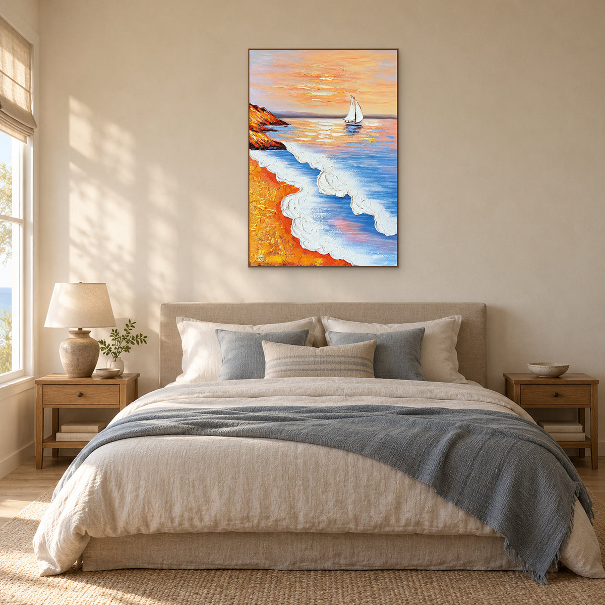 White sailboat and textured surf painting in an oak frame above a beige headboard, with blue and cream bedding.
