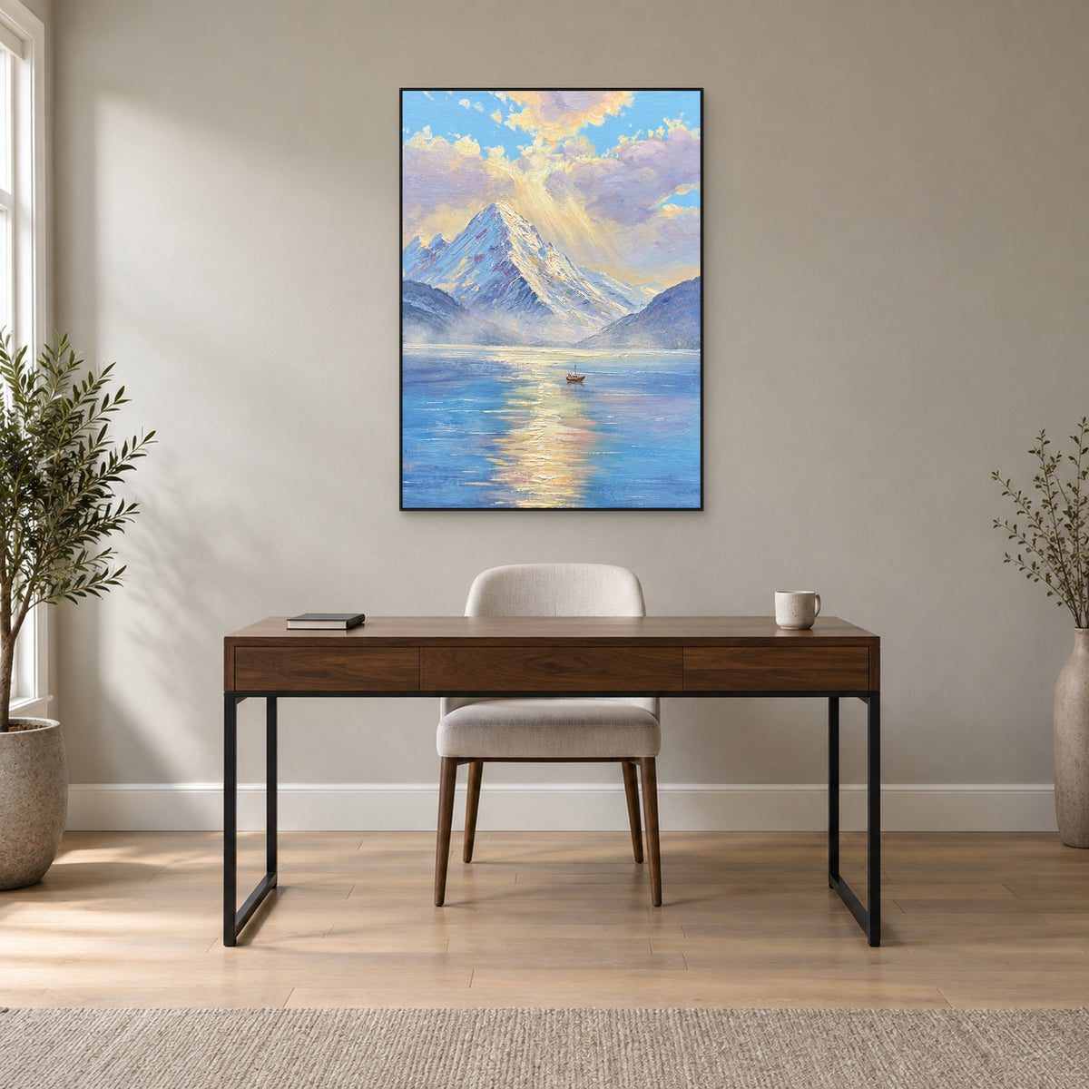 Morning mountain lake painting in a thin black floating frame centred above a walnut-colour writing desk