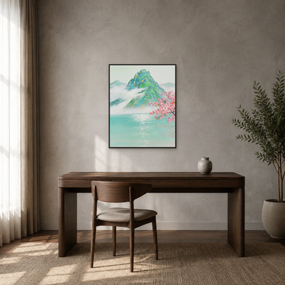 Turquoise lake and jade mountain painting in a slim black floating frame above a dark walnut desk