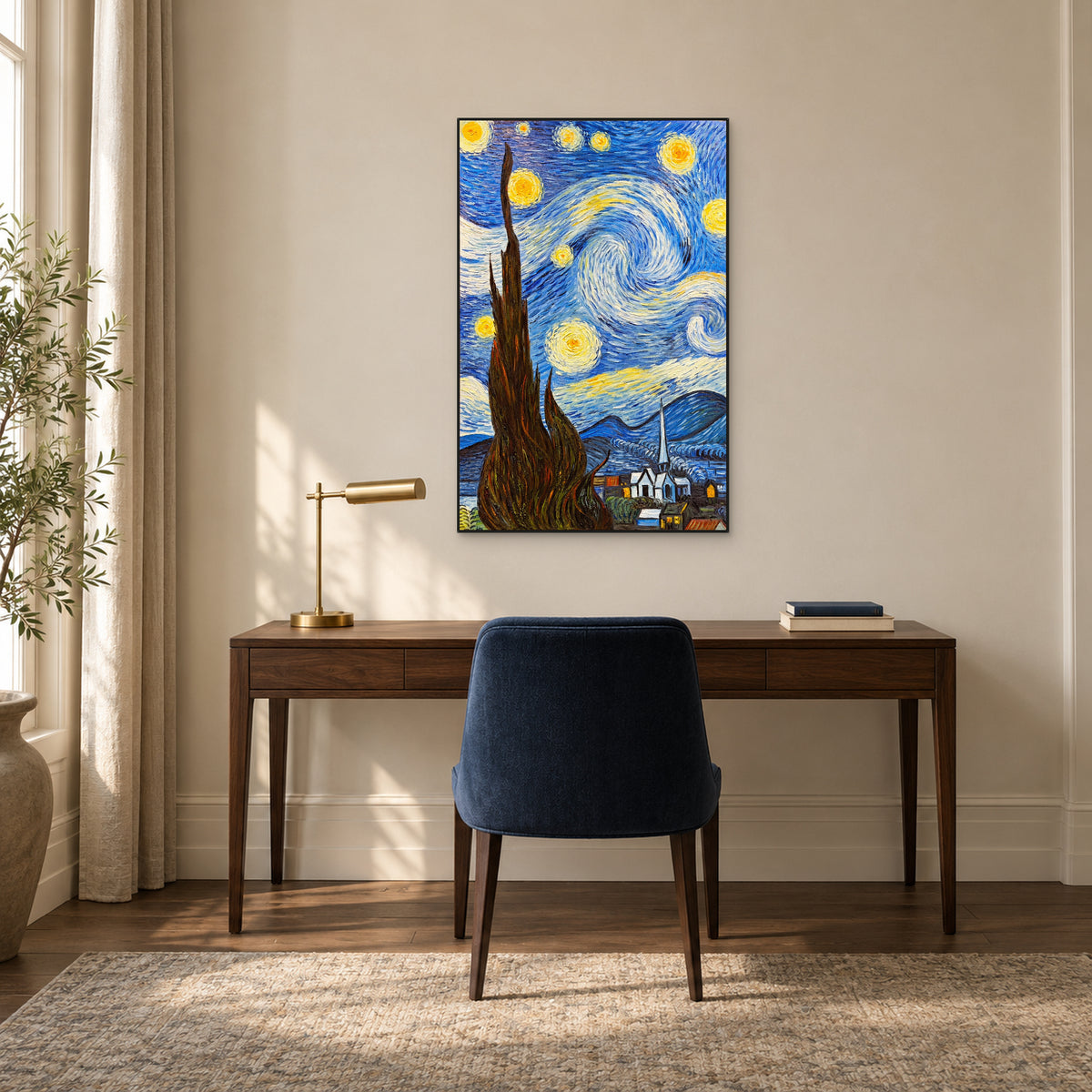 Blue starry sky and dark cypress in a thin black frame above a walnut desk with a navy chair