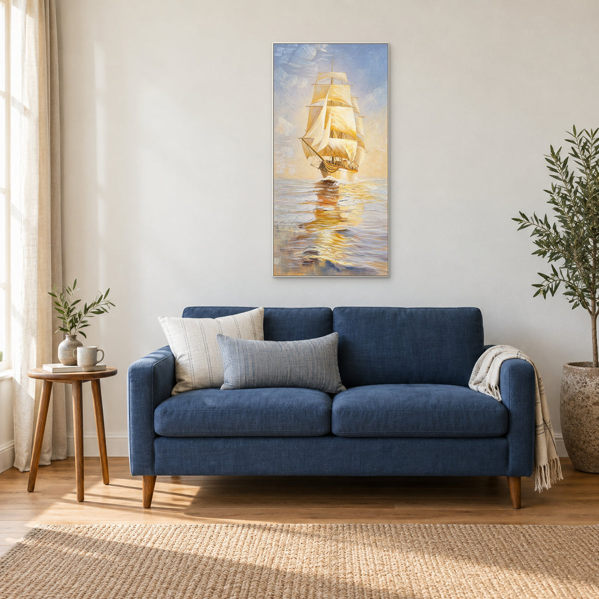 Golden Sails in a white floating frame above a blue loveseat in a softly lit reading corner.