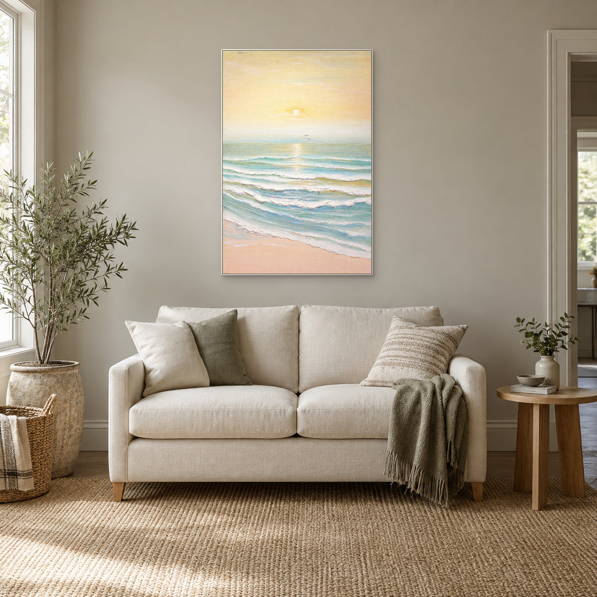 Morning Tide coastal painting in a white floating frame above a cream loveseat beside a window