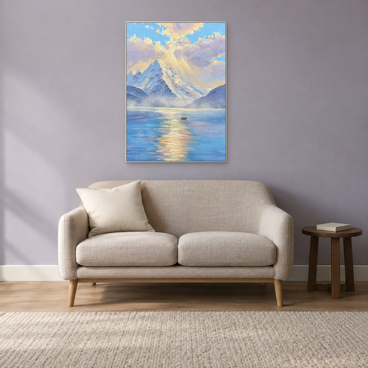 Snowy peak and small boat painting in a white floating frame above a linen loveseat against a lavender-grey wall
