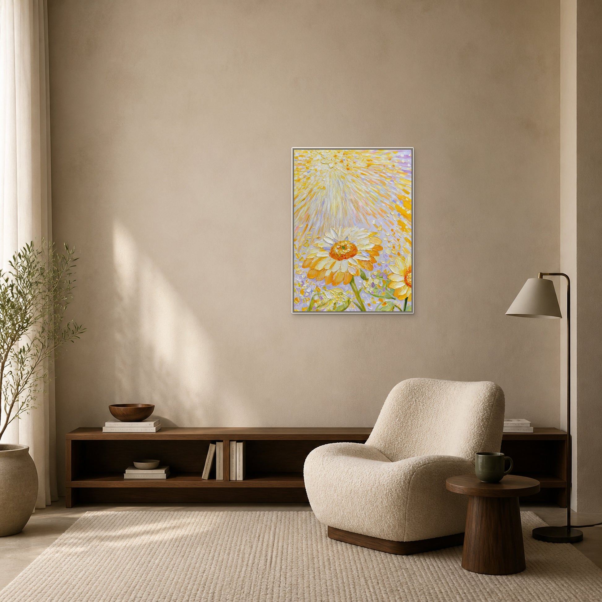 Sunflowers in Golden Light in a slim white floating frame above a walnut book bench beside a cream reading chair