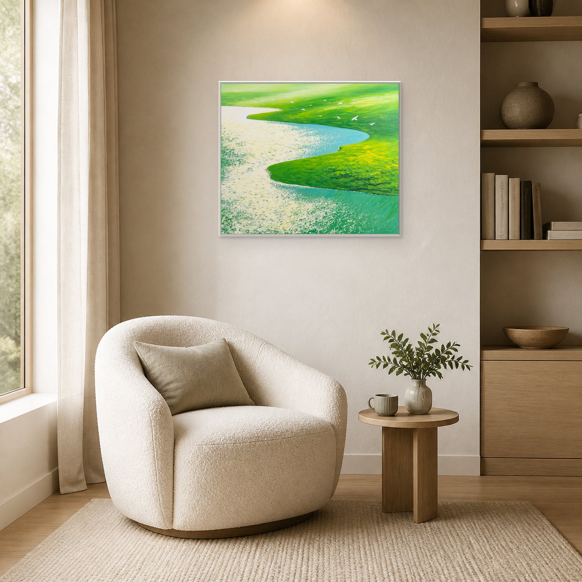 Flight Over Green Meadows in a slim white floating frame beside an ivory reading chair