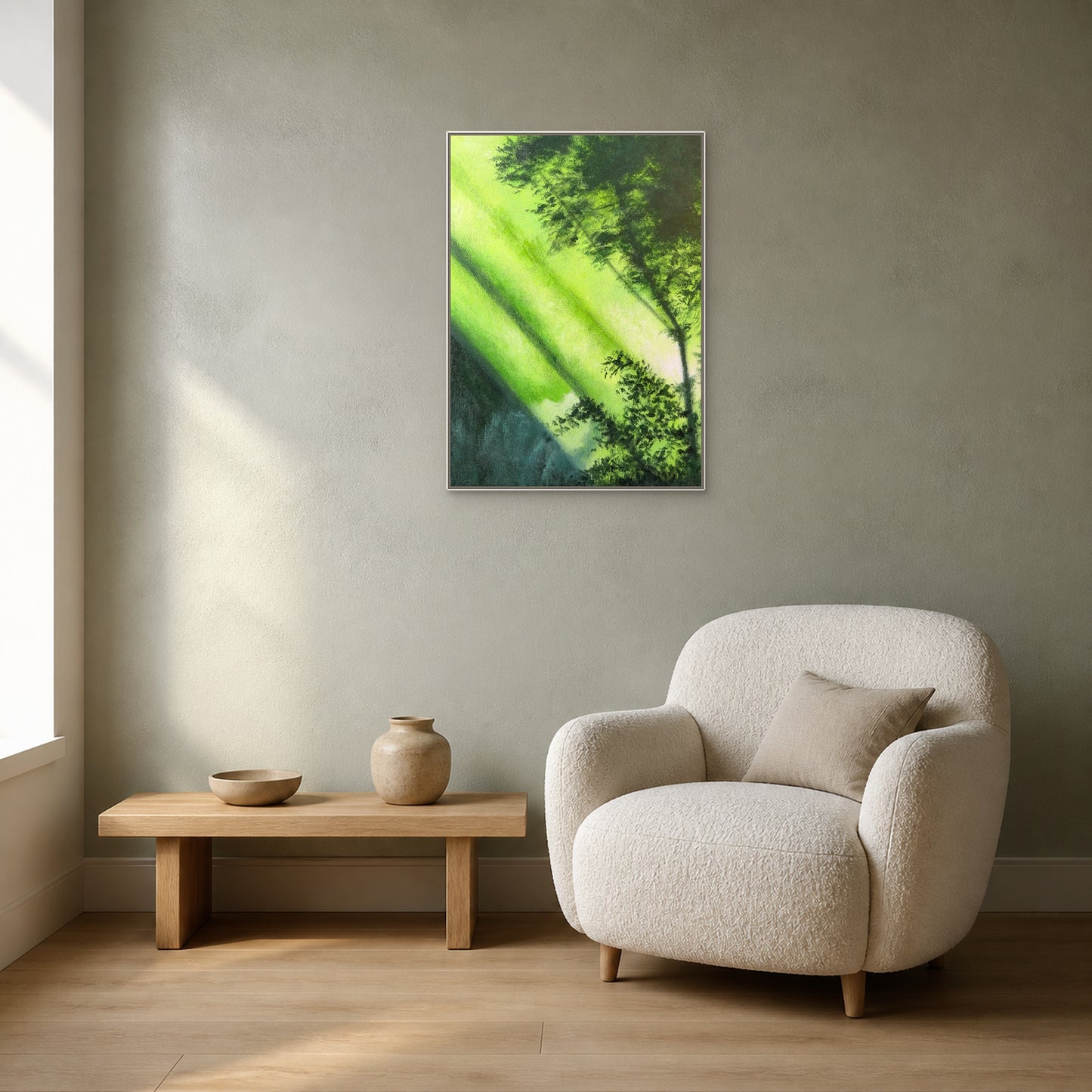 Forest Light in a slim white floating frame above an oak bench beside an ivory reading chair
