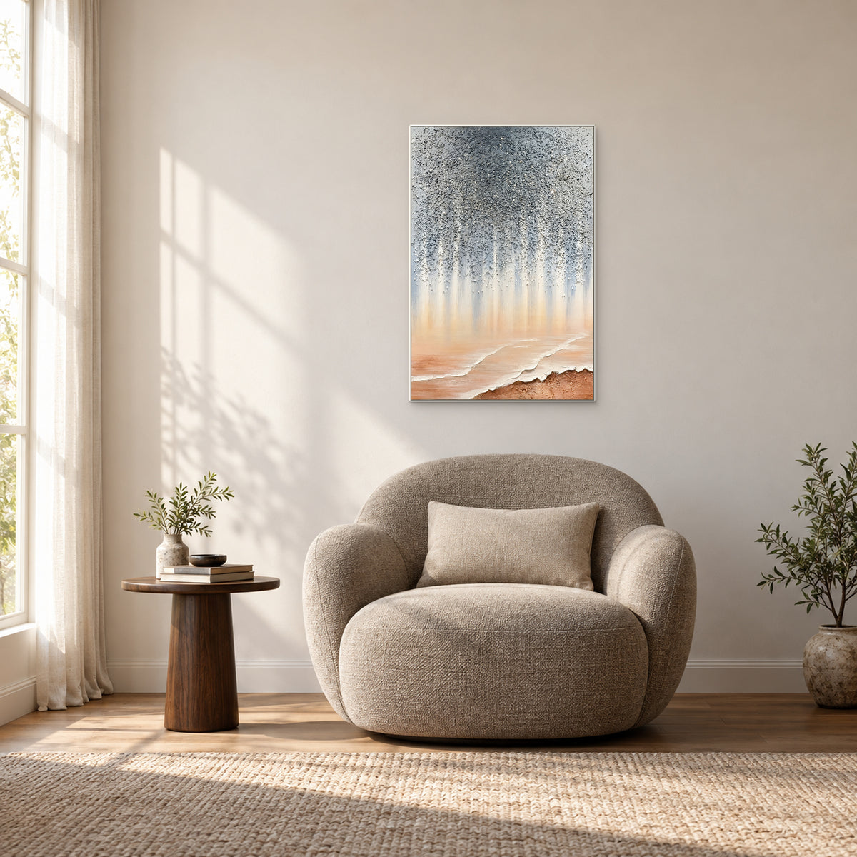 Stardust Shore in a white frame above a rounded taupe reading chair beside a sunlit window