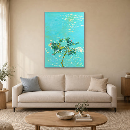 Turquoise botanical painting in a silver-tone frame centred above a cream sofa against a pale sand wall