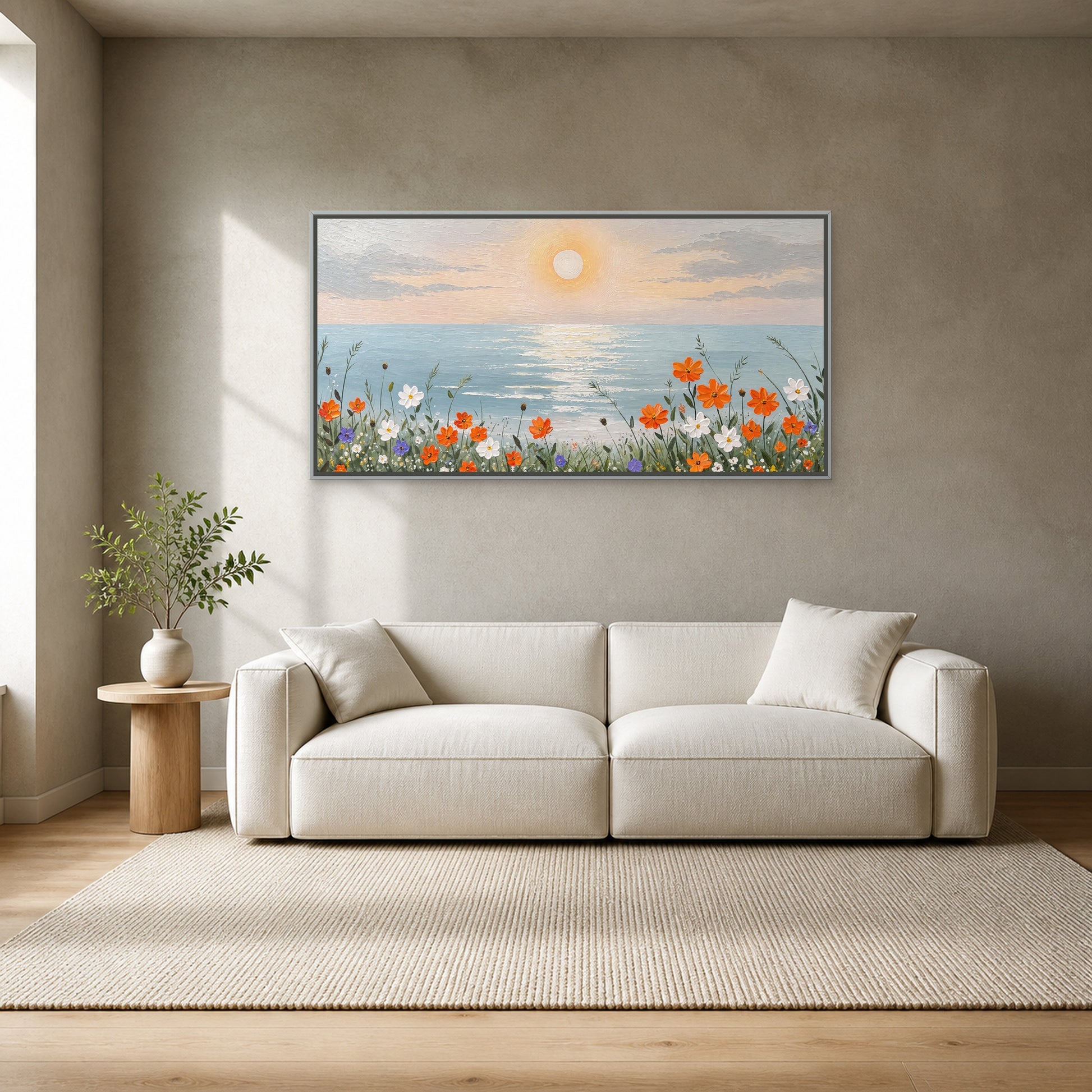 Coastal Bloom at Sunrise in a slim silver floating frame centred above an ivory sofa on a mineral-grey wall