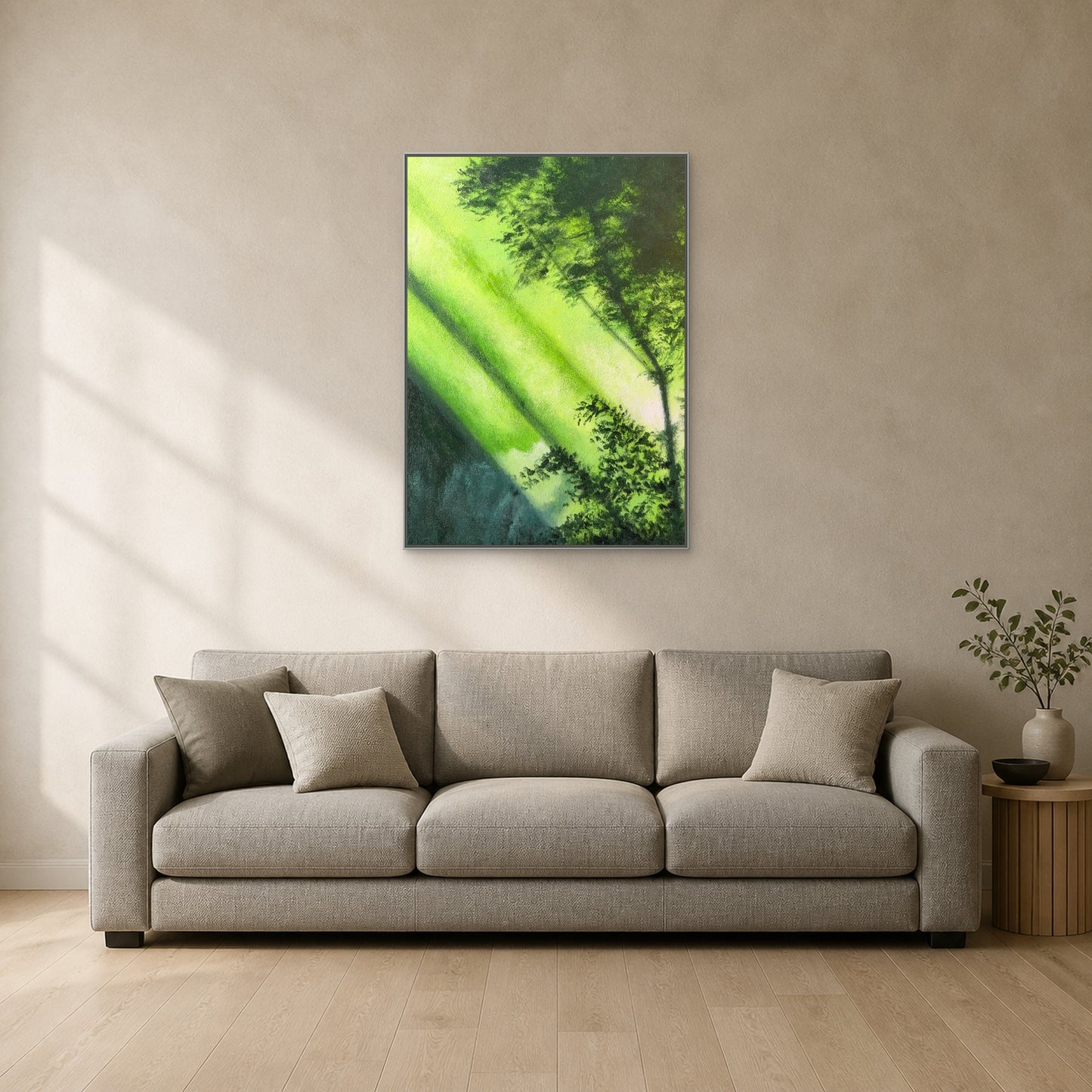 Forest Light in a slim silver floating frame centred above a neutral sofa