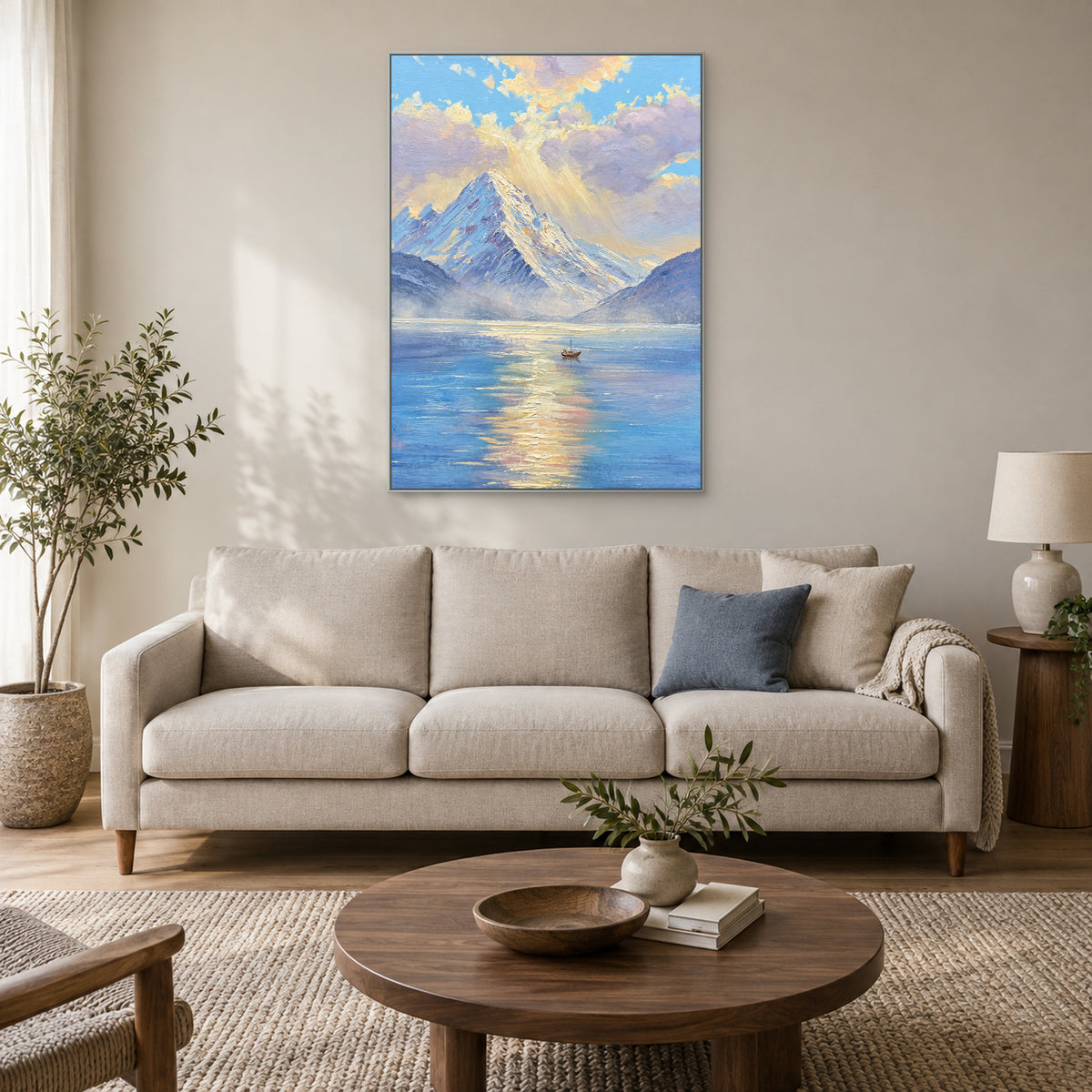 Blue lake and pale gold morning reflection painting in a silver-colour floating frame above a cream sofa
