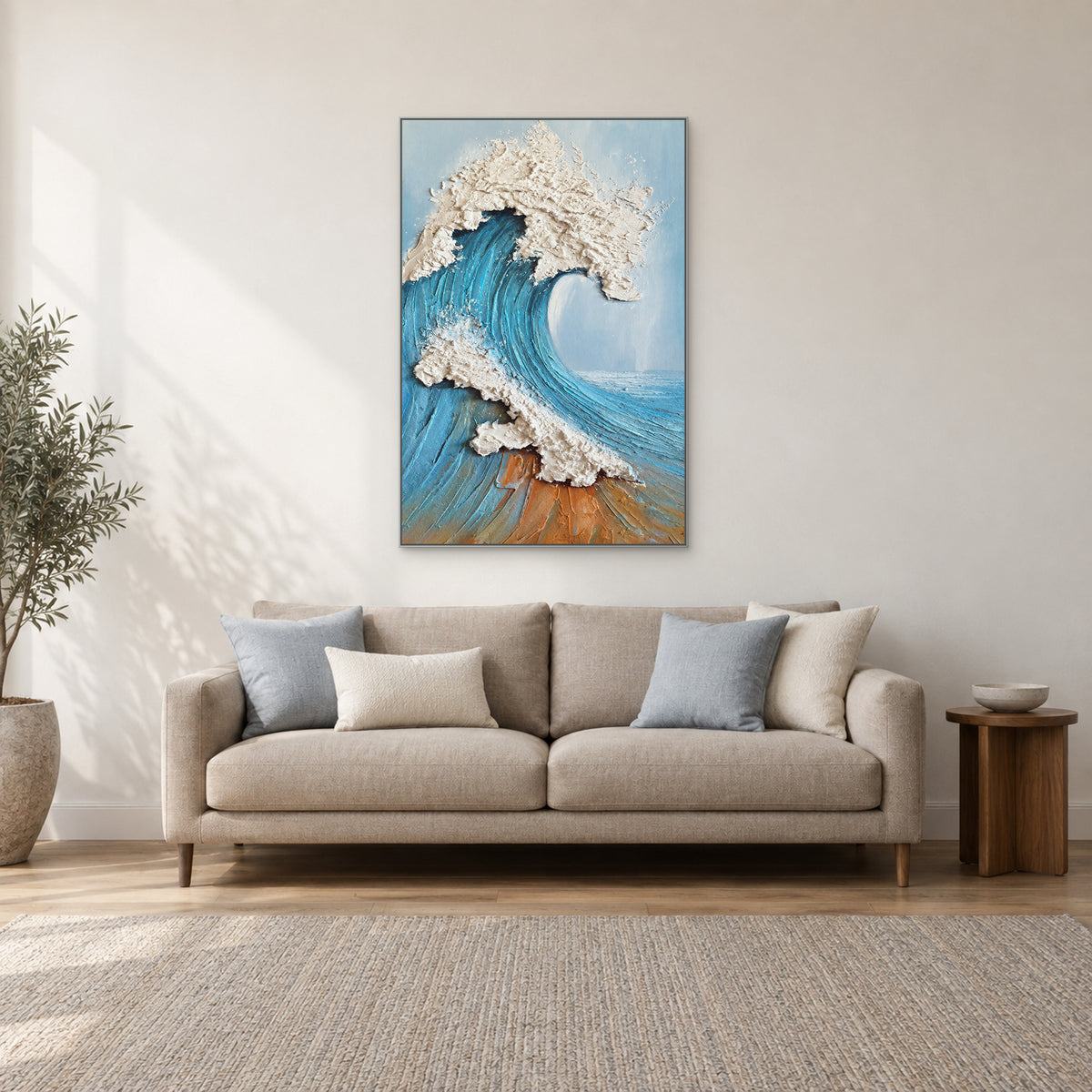 Sculpted Wave in a silver-tone floating frame above a cream sofa
