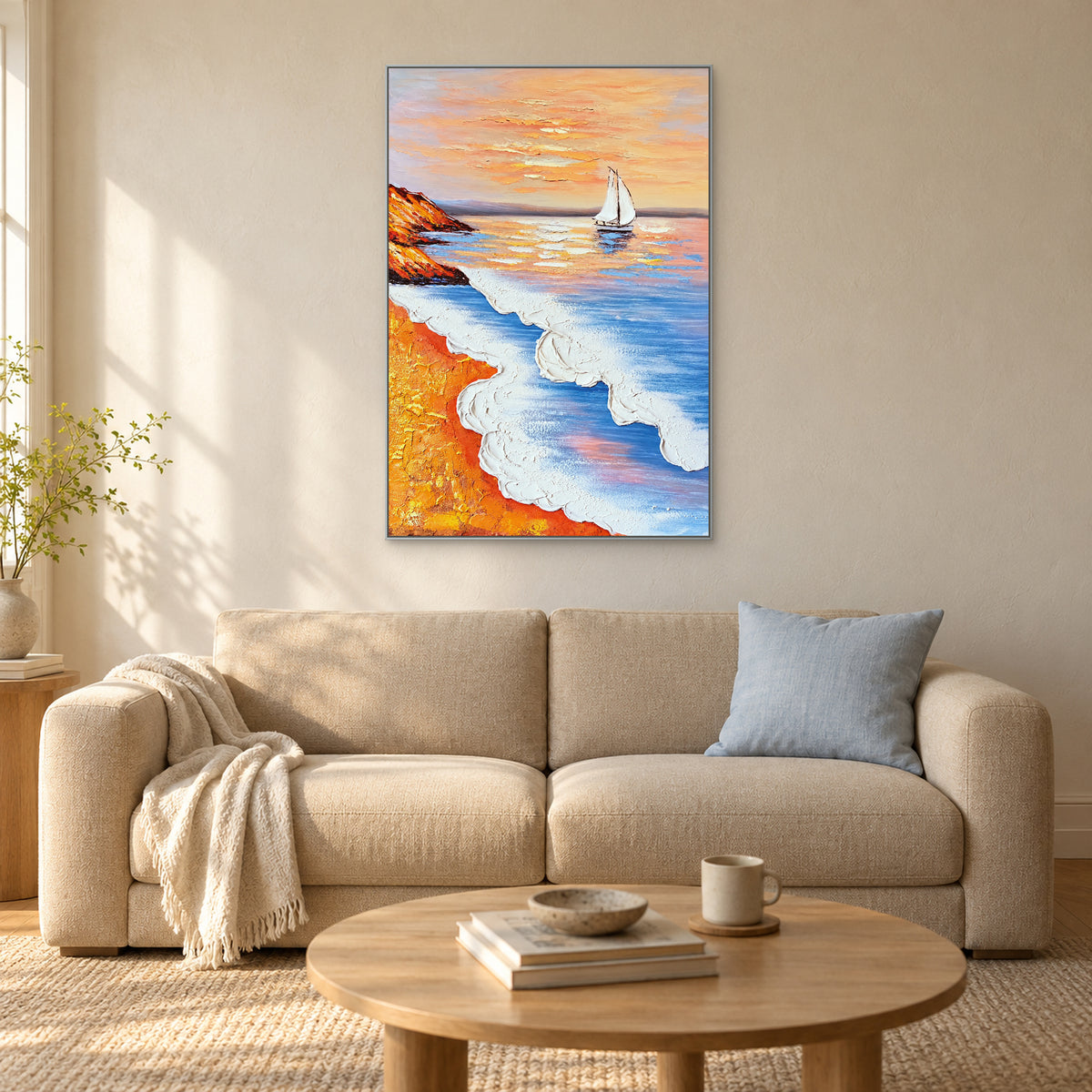 Blue surf and peach sky painting in a silver frame above a cream sofa with a blue cushion.