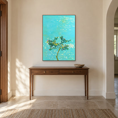 Pink blossom tree and turquoise water painting in a walnut-tone floating frame above a wooden entry console