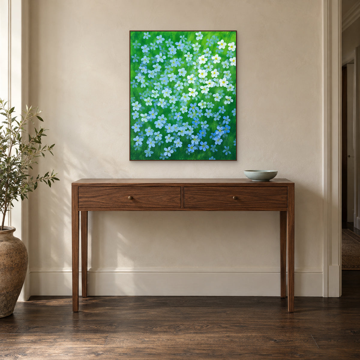 Blue flax flower wall art in a walnut floating frame above an entryway console