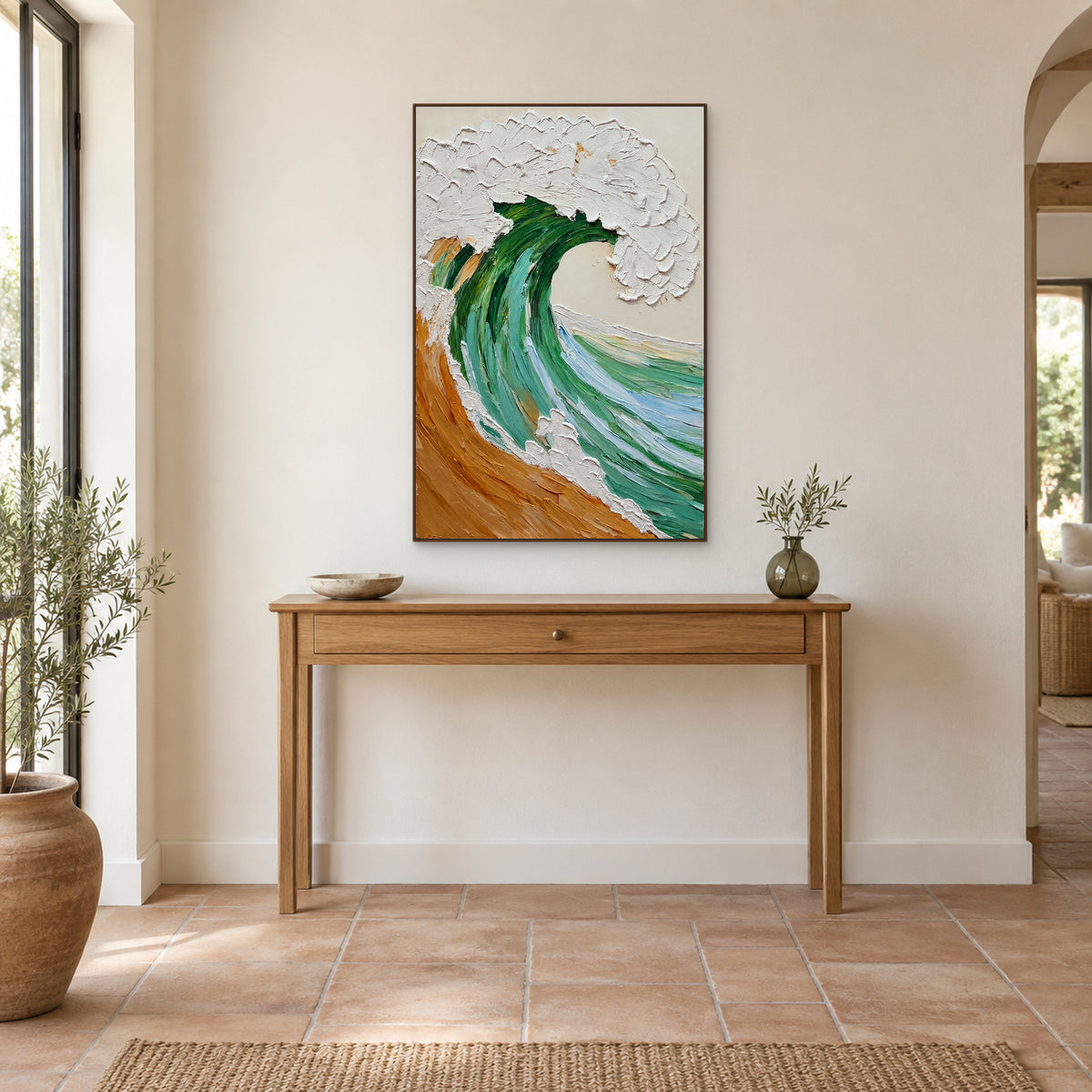 Emerald wave artwork in a walnut-tone frame aligned above a narrow wooden entryway console
