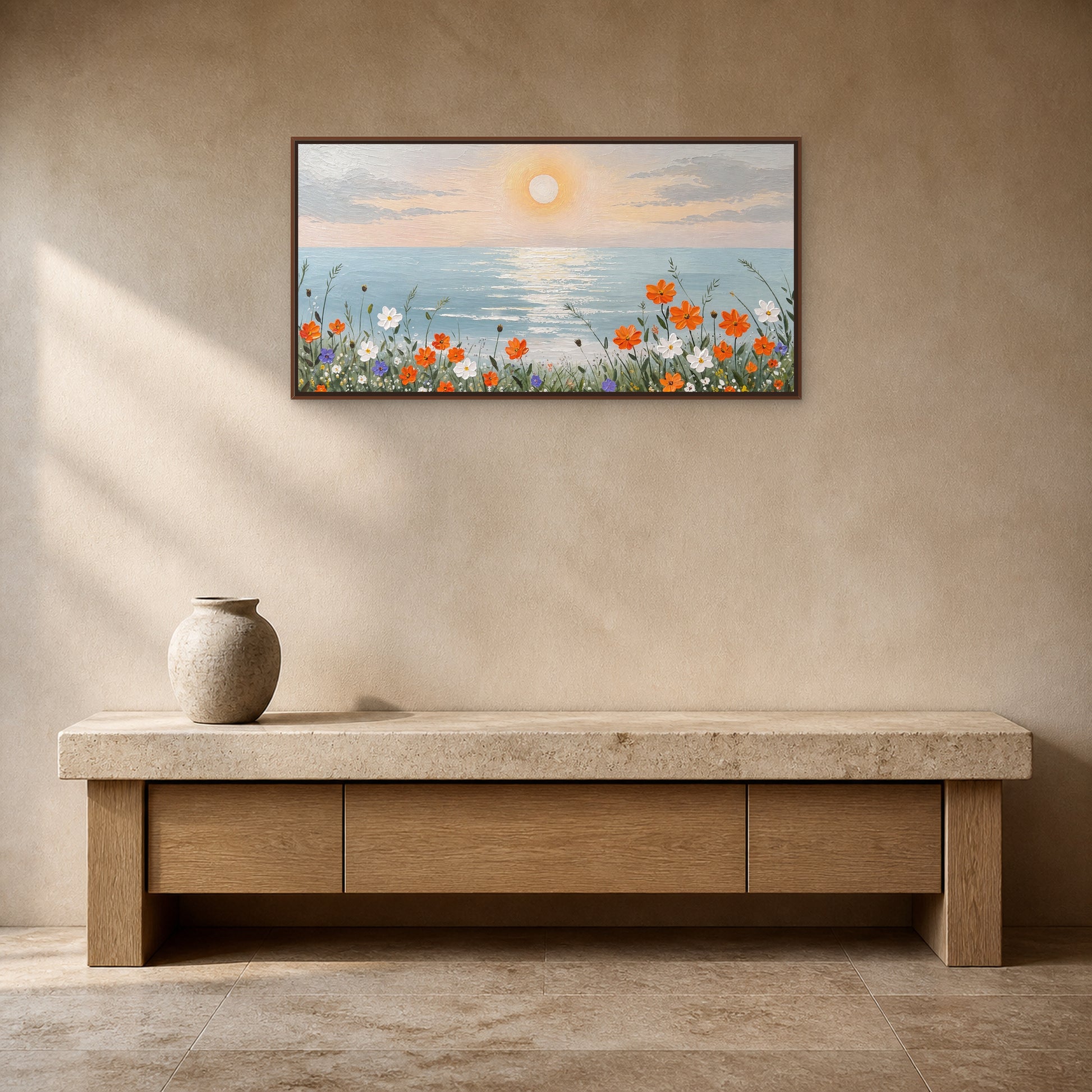 Coastal Bloom at Sunrise in a slim walnut floating frame above a travertine-and-oak console on a mushroom-beige wall