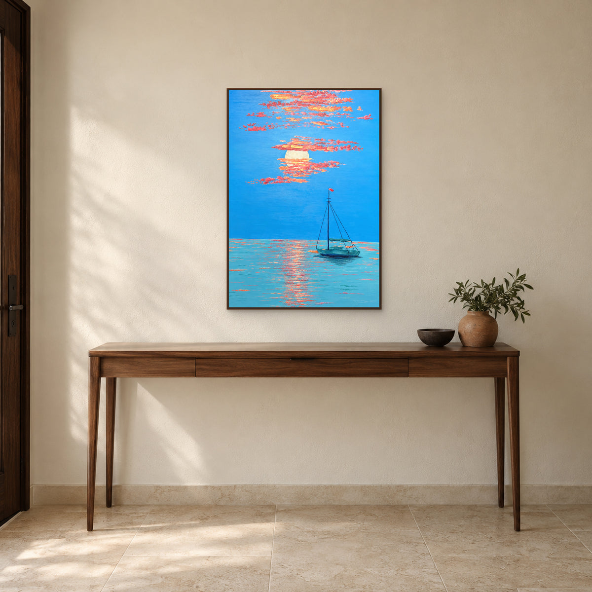 Blue and coral sunset boat painting in a walnut-tone floating frame above a slender wooden entrance console.