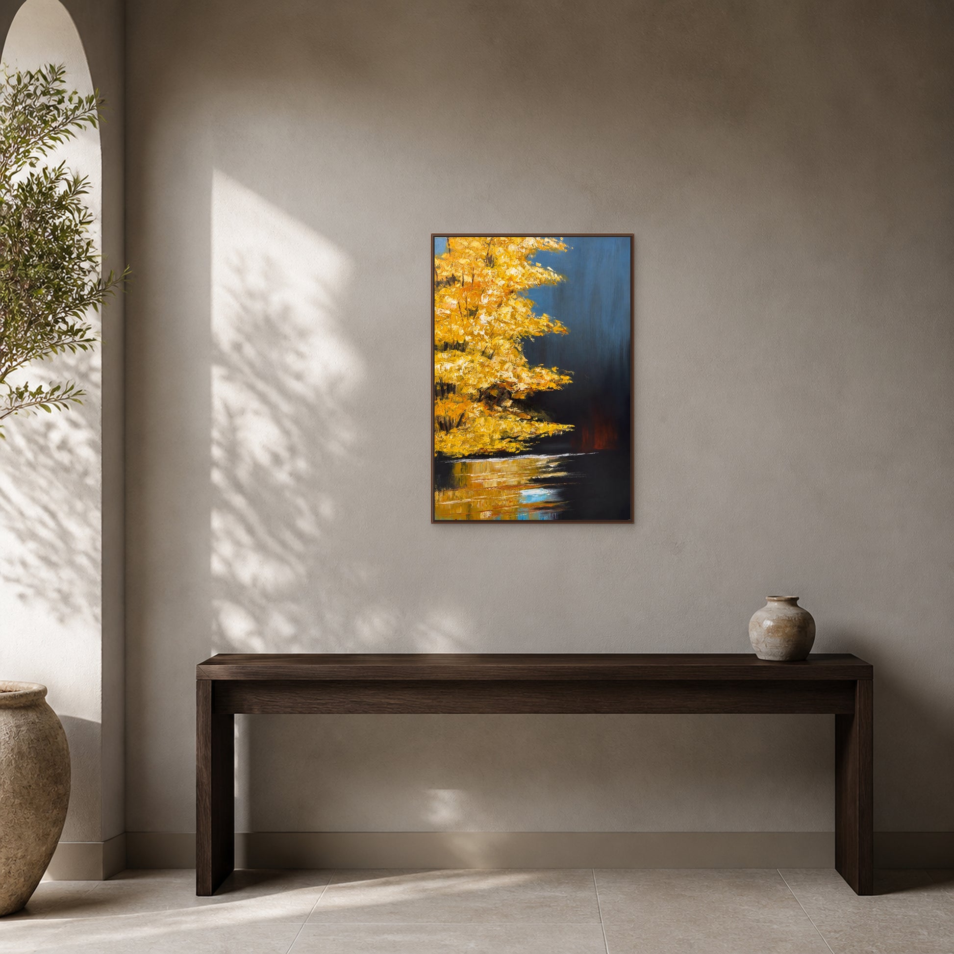 Golden Maple at Dusk in a slim walnut floating frame above a dark walnut console in a warm mineral-grey entryway