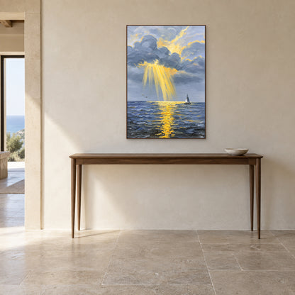 Golden rays over blue water in a walnut-look frame above a narrow console.