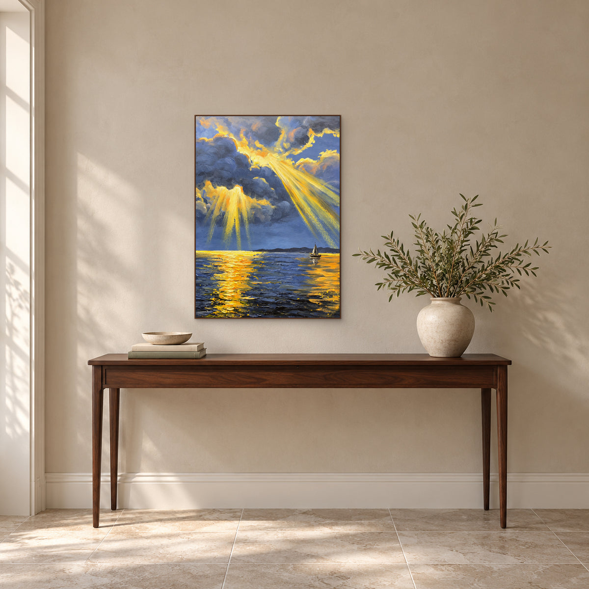 Golden rays over blue water in a walnut-tone frame above a console, with leafy branches to the right.
