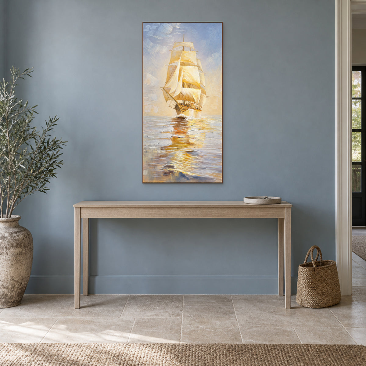 Golden Sails in a walnut-toned floating frame above a light wooden console against a dusty blue wall.