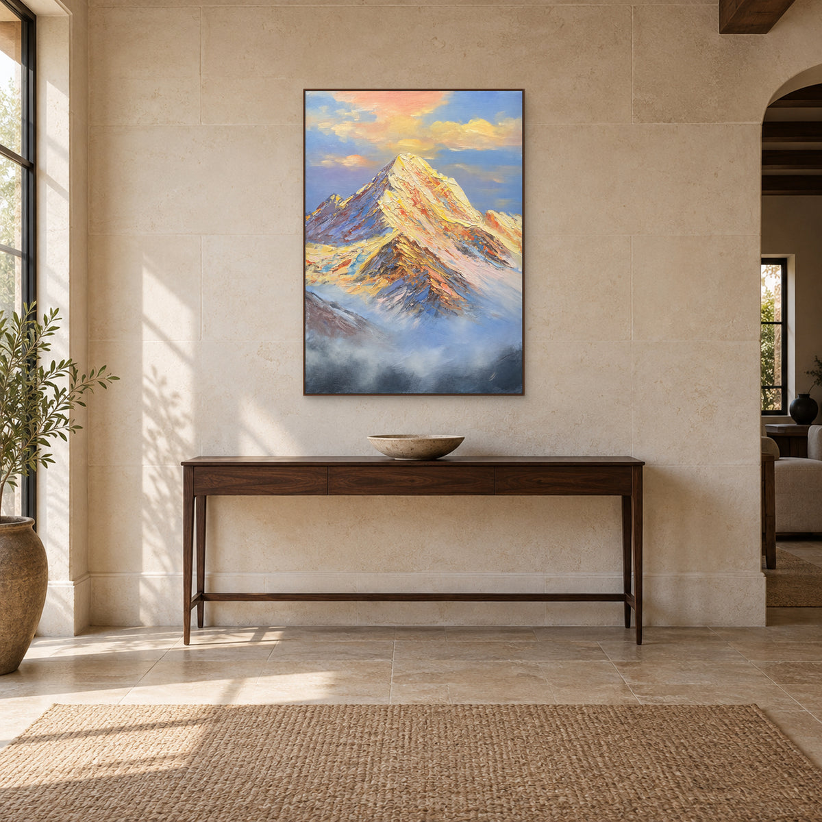 Golden snowy summit in a walnut-tone frame above a dark wooden entryway console