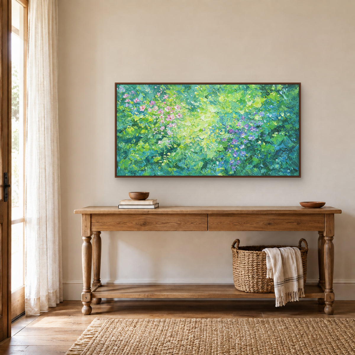 Flower-filled green panorama in a walnut-toned floating frame above a wood console with turned legs and a basket beneath