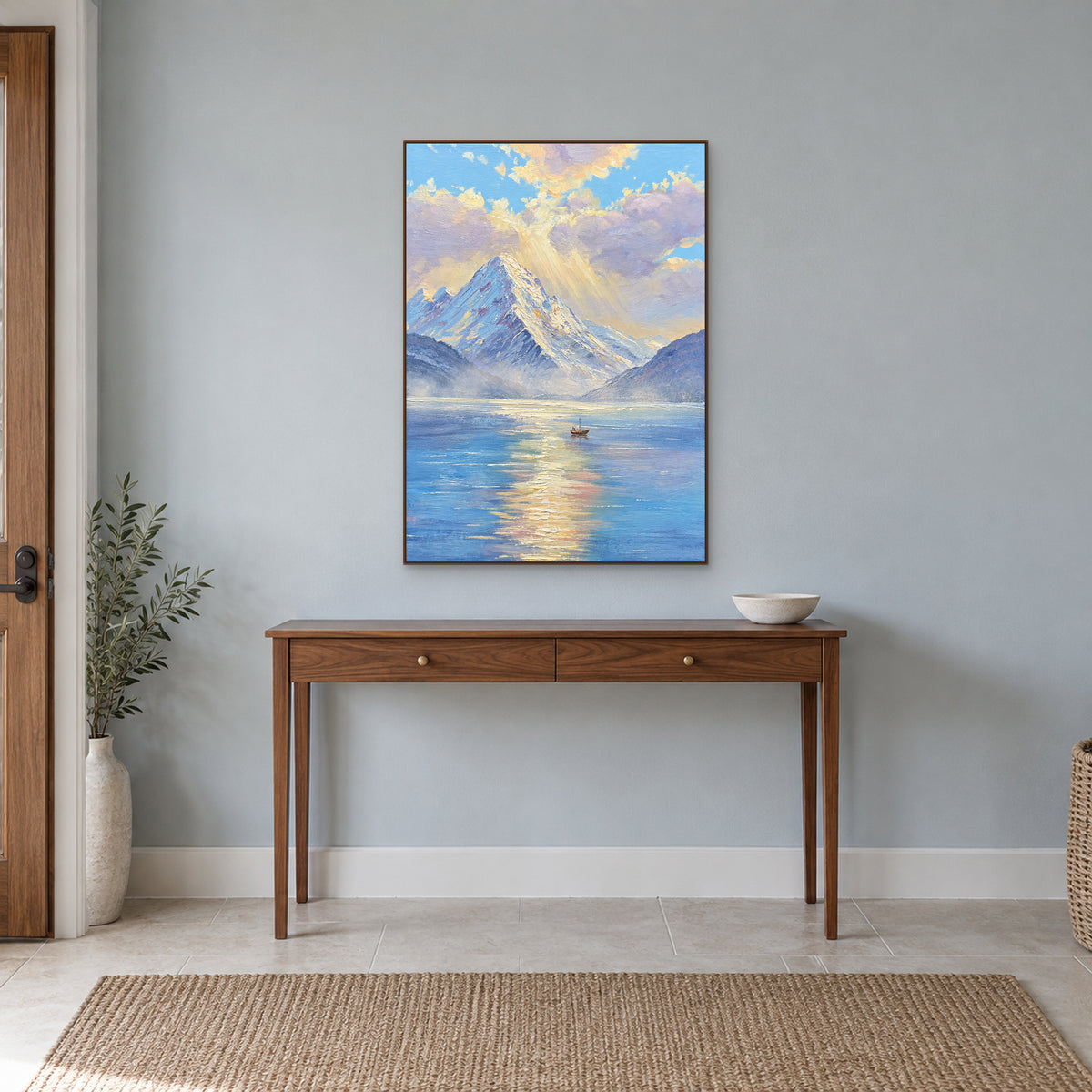 Vertical mountain lake artwork in a walnut-colour floating frame above an entryway console