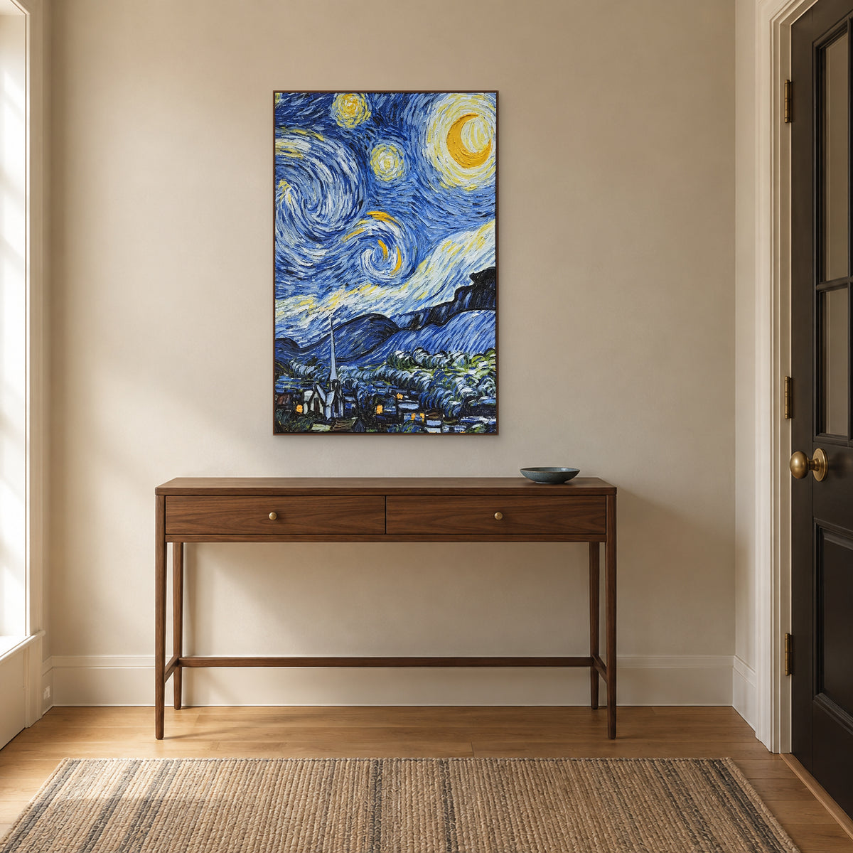 Yellow crescent and blue sky swirls in a walnut-look frame above a slim wooden entryway console.