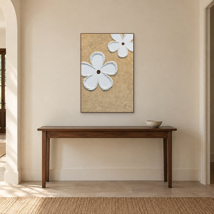 White Petal Duet in a walnut-toned frame centred above a dark wooden entryway console