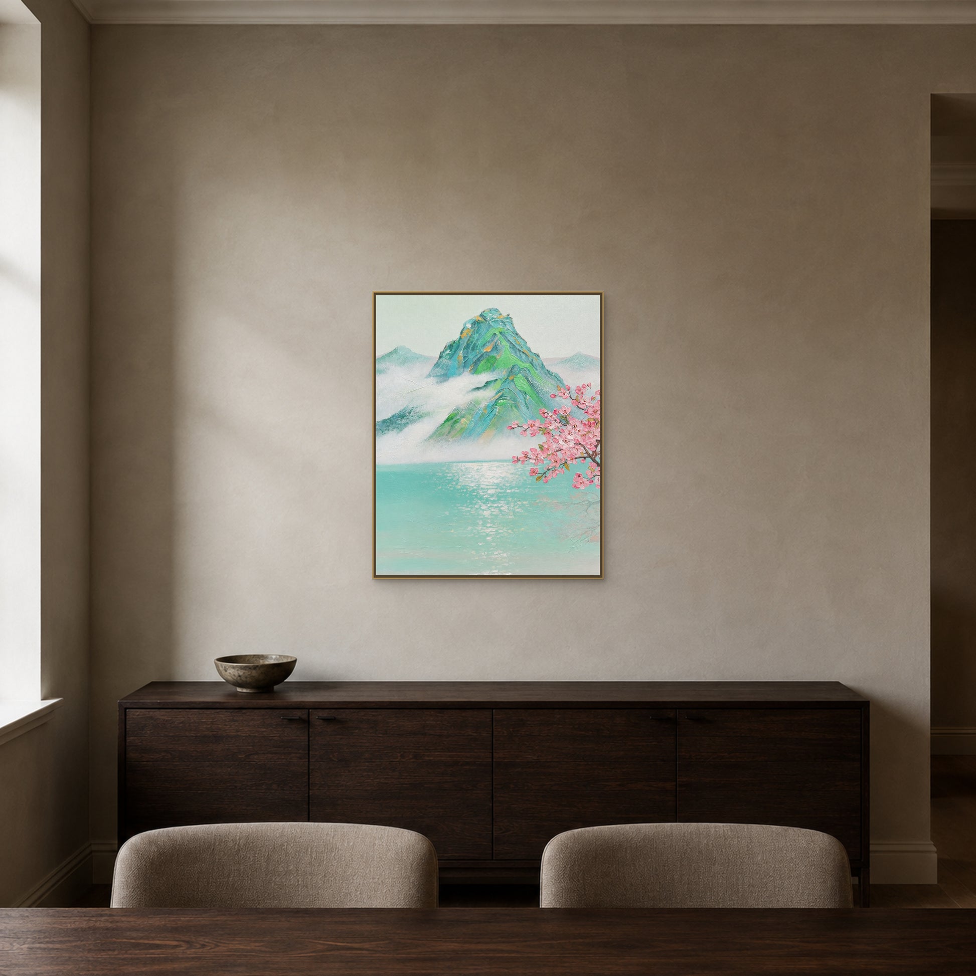 Misty peak landscape in a slim champagne floating frame above a dark-oak dining sideboard