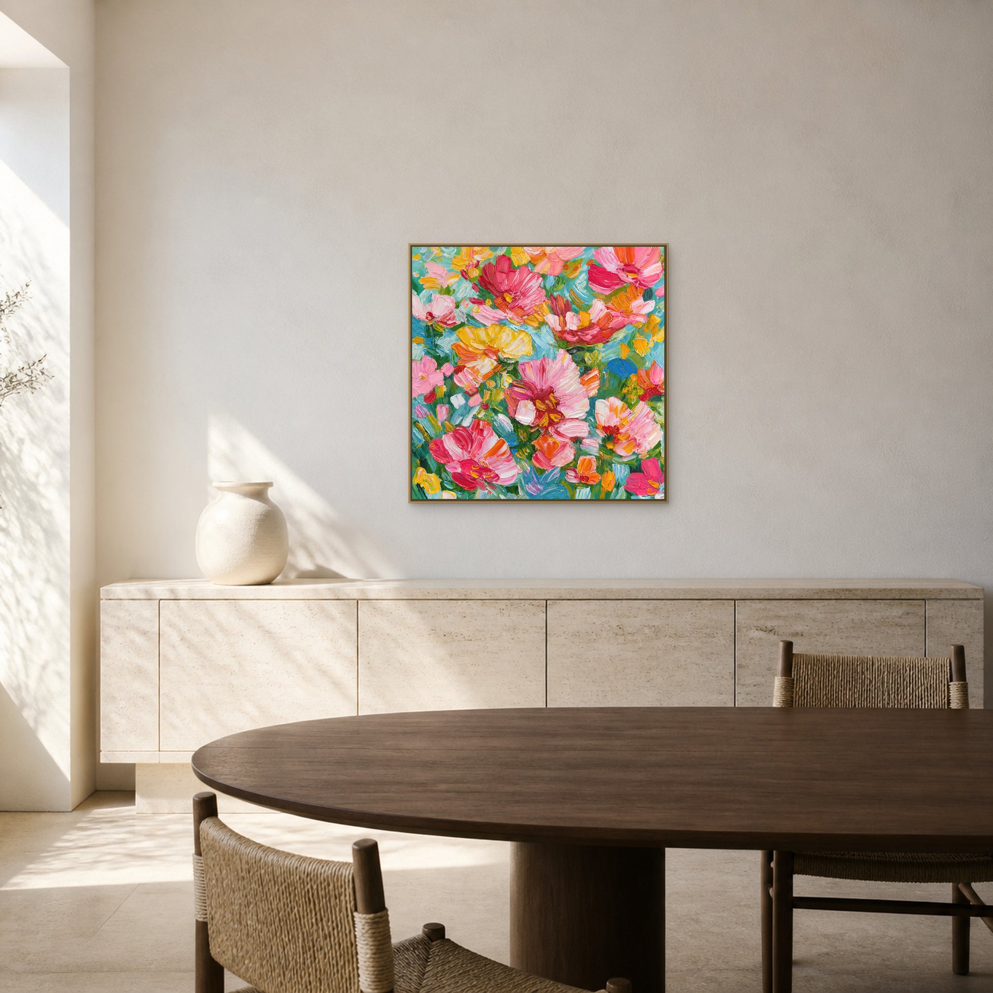 Floral Abundance in a slim champagne floating frame above a pale travertine credenza in a bright dining room