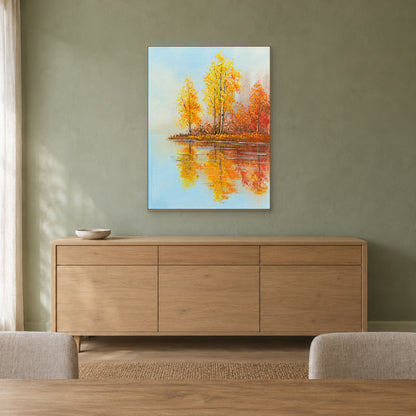Golden autumn lake scene in a champagne-tone frame above a light wood sideboard on a muted green wall
