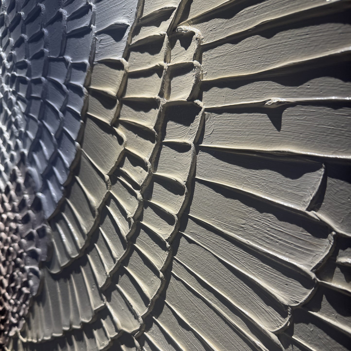 Close side view of Kanso Flux layered concentric relief texture